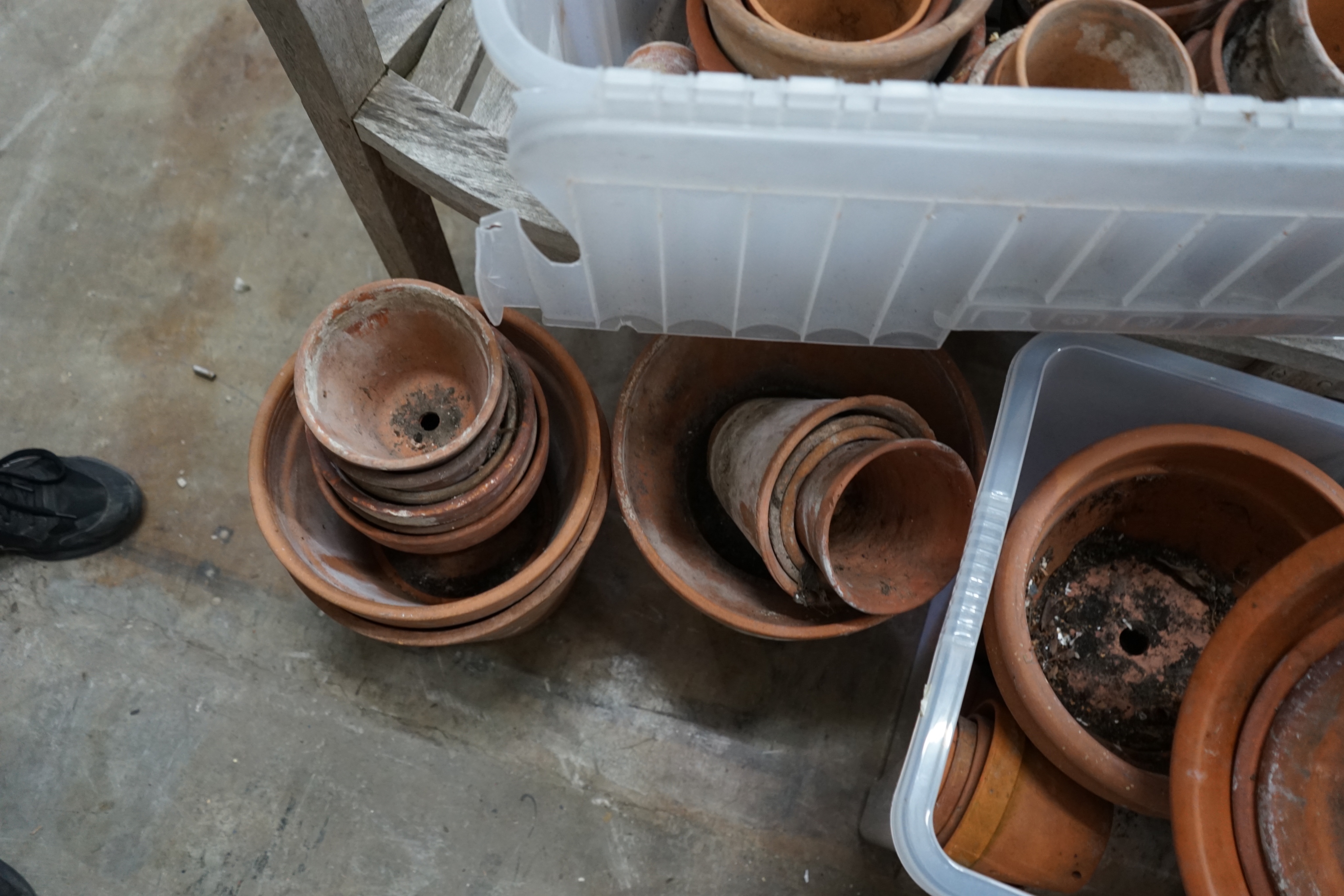 Approximately 100 terracotta garden pots, largest diameter 33cm height 28cm